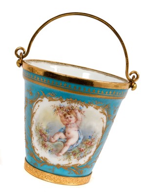 Lot 237 - 19th century Sèvres Chateau des Tuileries gilt brass mounted bucket, painted with a cherub, signed Quentin, marked to base