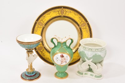 Lot 239 - Four pieces of Minton porcelain, including an Aesthetic style goblet with jewelled enamelling, a green-ground vase painted with a cherub, another vase, and a gilded cabinet plate (4)