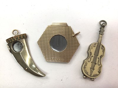 Lot 1057 - 1960s 9ct gold hexagonal cigar cutter with engine turned decoration and two further cigar cutters (3)