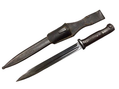 Lot 1015 - Second World War Nazi German K98 bayonet with fullered steel blade, stamped 42 crs, 6420Cin scabbard with leather frog.