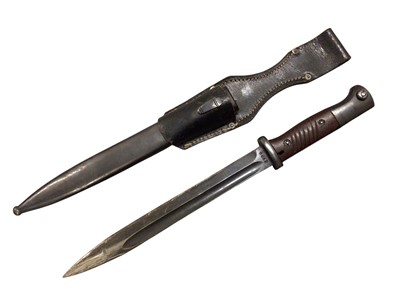 Lot 1016 - Second World War Nazi German K98 bayonet with fullered steel blade (sharpened for active service), stamped F. W. Holler, 8822 in scabbard with leather frog, dated 1942.