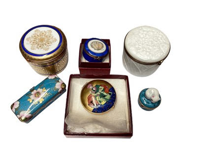 Lot 1167 - Four Limoges porcelain boxes retailed by Asprey (two boxed), including one as a cat, together with two Limoges boxes retailed by Reynaud (6)