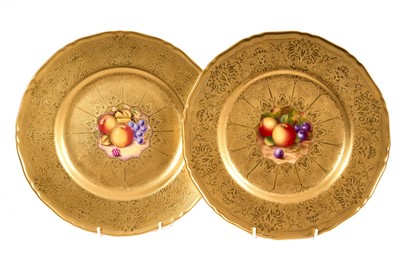 Lot 244 - Pair of Royal Worcester hand painted fruit plates, on gilt-tooled ground, stamped marks