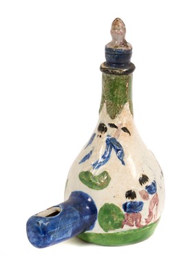 Lot 204 - Rare pearlware pottery bird feeder, circa 1830, decorated in relief and painted in enamels with an elephant, an angel, and children playing, 13cm high