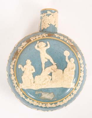 Lot 35 - Unusual 19th century pottery flask, decorated in relief with figural scenes and flowers, inscribed with the initials 'TS', on a blue-glazed ground, 17.5cm high