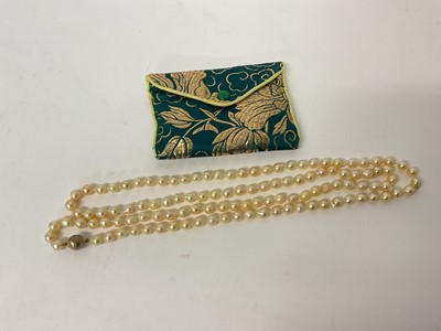 Lot 108 - Long string of cultured pearls with silver gilt clasp, 105cm long