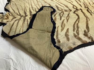 Lot 1739 - Early 20th century tiger skin on black backing, probably by Van Ingen, nose to tail 260cm x paw to paw 190cm