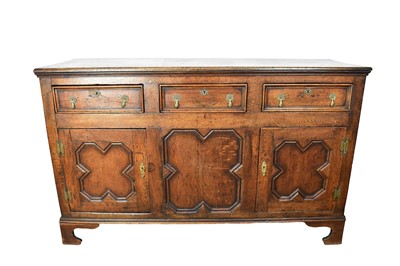 Lot 1590 - Early 18th century and later oak dresser base with panelled doors