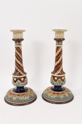 Lot 217 - Pair of Doulton Lambeth stoneware candlesticks, with spiralled stems, 30cm high