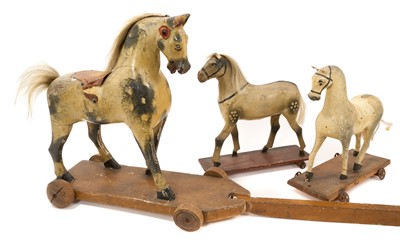 Lot 1022 - Three Victorian push along horses