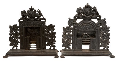 Lot 1030 - Two 19th century miniature cast iron fire places