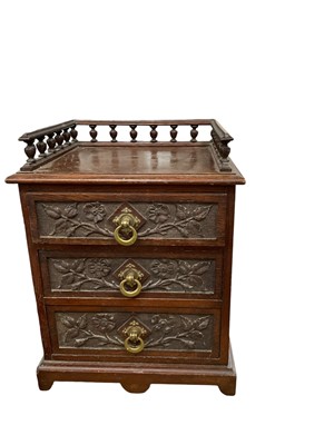 Lot 244 - Late 19th century carved oak table top chest of three drawers