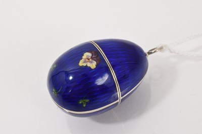 Lot 745 - Silver and guilloché blue enamel egg pendant with pansy decoration