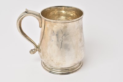 Lot 536 - George V silver tankard of baluster form with scroll handle, raised on a circular foot, (London 1910), maker Spink & Son, 12ozs, 12.5cm in height.