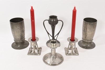 Lot 983 - Pair of Tudric pewter Art Nouveau vases, model 01145 and four pewter candlesticks