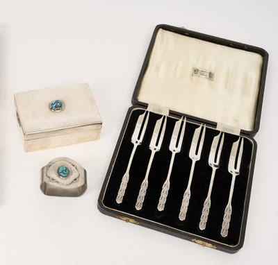 Lot 1176 - Liberty & Co cased set of silver cake forks, Edwardian Liberty & Co silver box with turquoise stone set to cover and a Liberty & Co pewter napkin ring (3)