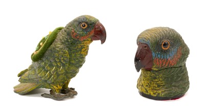 Lot 1014 - Early 20th century cold-painted metal parrot pin cushion, 10cm high and similar inkwell