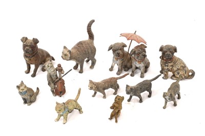 Lot 1015 - Collection of cold painted metal cats and dogs, the largest 5cm high. (11)