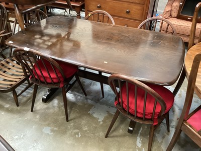 Lot 1230 - Ercol elm refectory dining table and four chairs