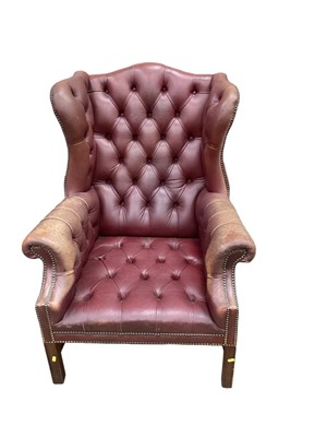 Lot 1217 - Georgian style leather wing back armchair