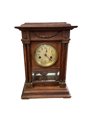 Lot 203 - Edwardian oak cased mantel clock.