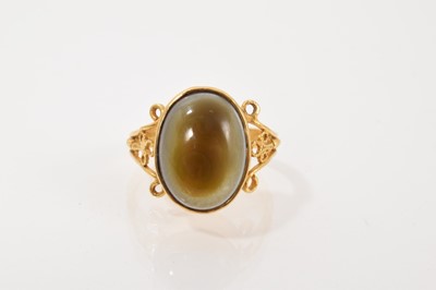 Lot 704 - Antique gold ring with an agate cabochon stone