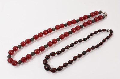 Lot 22 - Two vintage simulated cherry amber bead necklaces