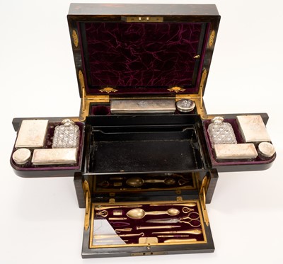 Lot 402 - Victorian brass bound coromandel dressing table box with silver contents