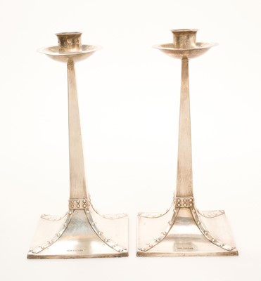 Lot 444 - George V silver Arts and Crafts style candlesticks