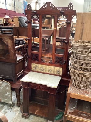 Lot 1258 - Late Victorian mahogany hall stand with mirrored back, inset with four Minton tiles, marble top and frieze drawer