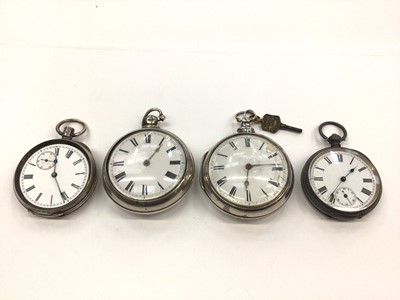 Lot 18 - Two Georgian silver pair cased pocket watches, together with two other silver pocket watches (4)