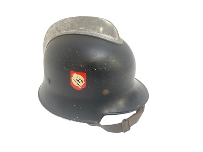 Lot 733 - Nazi M34 pattern Fire Police helmet with original aluminium comb, black painted finish with two decals (de-nazified), leather liner and chinstrap.