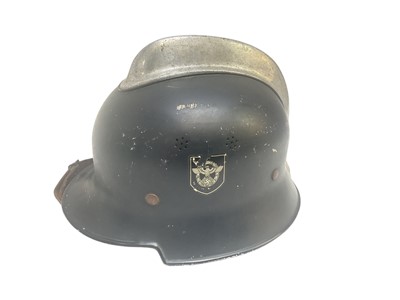 Lot 733 - Nazi M34 pattern Fire Police helmet with original aluminium comb, black painted finish with two decals (de-nazified), leather liner and chinstrap.