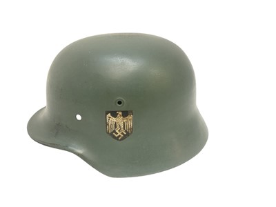 Lot 736 - Second World War Nazi M40 helmet shell with grey painted finish and single decal, stamped under brim EF 66, named to Lt. Heinrich.