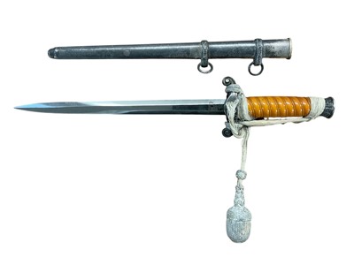 Lot 988 - Nazi Wehrmacht 1935 pattern officers' dress dagger with silver plated pommel and crossguard, orange celluloid grip, plain blade, by Eickhorn Solingen in scabbard.