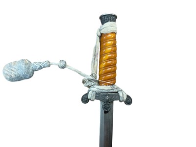 Lot 988 - Nazi Wehrmacht 1935 pattern officers' dress dagger with silver plated pommel and crossguard, orange celluloid grip, plain blade, by Eickhorn Solingen in scabbard.