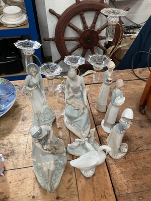 Lot 31 - A glass and brass five-branch candelabra with thistle decoration, together with a group of Nao and similar figures