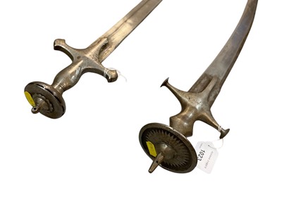 Lot 1023 - Two 19th century Indian Tulwars, the blades approx. 85 and 82cm in length respectively.