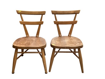 Lot 1220 - Pair of Ercol elm children's chairs