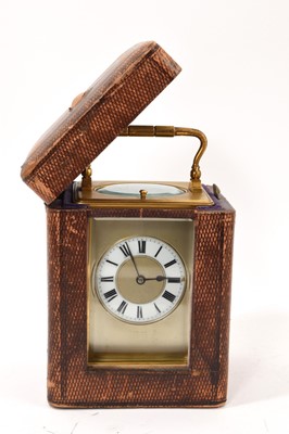 Lot 858 - Late 19th century French carriage clock with repeating movement and enamel dial in brass case, in original travelling case