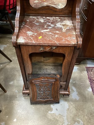Lot 1222 - Edwardian carved oak coal purdonium, mahogany framed swing mirror and a reproduction bookcase with shelves and drawers (3)