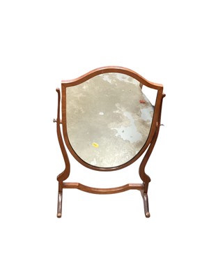 Lot 1222 - Edwardian carved oak coal purdonium, mahogany framed swing mirror and a reproduction bookcase with shelves and drawers (3)
