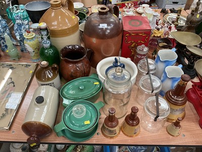 Lot 424 - Two stoneware flagons, green enamel dishes, empty Wade Bell's whisky decanters and other items.