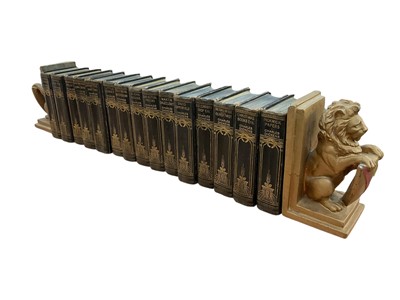 Lot 1549 - Fifteen Volumes, Charles Dickens Published by the Waverley Book Company, and lion book ends