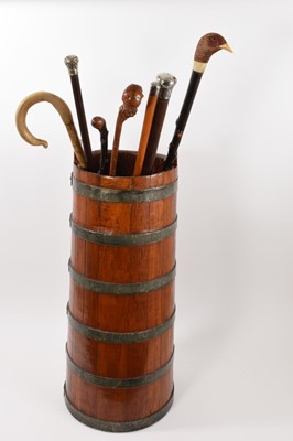 Lot 1112 - Group of walking sticks in coopered stick stand