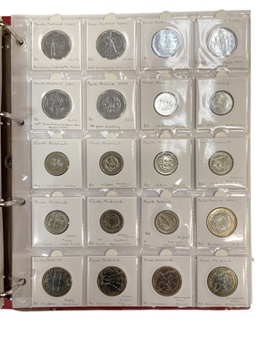 Lot 422 - G.B. - A red coin album containing a mixed collection of 20th-21st century coinage to include some silver issues (Qty)