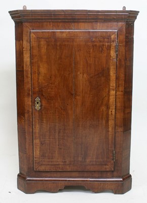 Lot 1670 - Early 18th century walnut corner cupboard