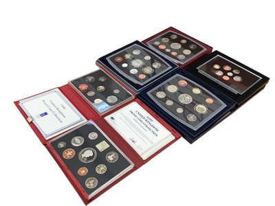 Lot 433 - G.B. - Royal Mint mixed year proof sets to include 1970 x 6, 1972, 1990 (N.B. Red case) 1999 (N.B. Blue case) 2000, 2001, 2003 & 2008 'Royal Shield of Arms' (13 coin sets) (N.B. Cased with C...