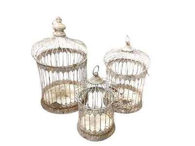 Lot 1298 - Three grauduated bird cages, largest is 53cm high