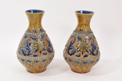 Lot 256 - Pair of Doulton Lambeth bottle vases by Emily Partington, marks to bases, 23cm high